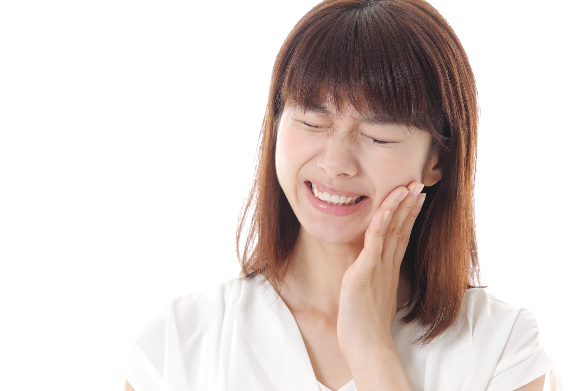 虫歯が痛む女性